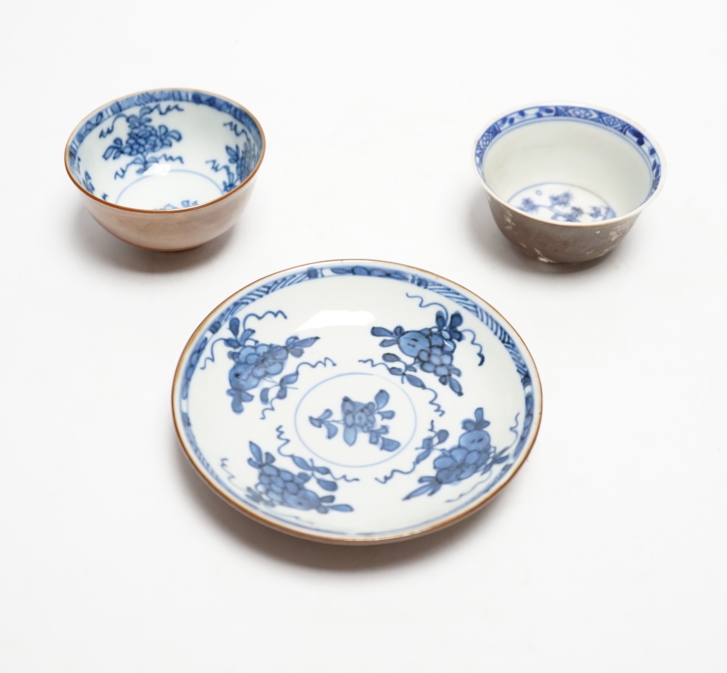 A Chinese Nanking cargo type tea bowl, another tea bowl and saucer, Qianlong period